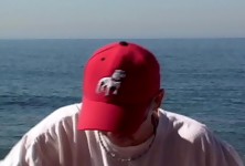 Black Babe Kitten in One-Piece Sucking